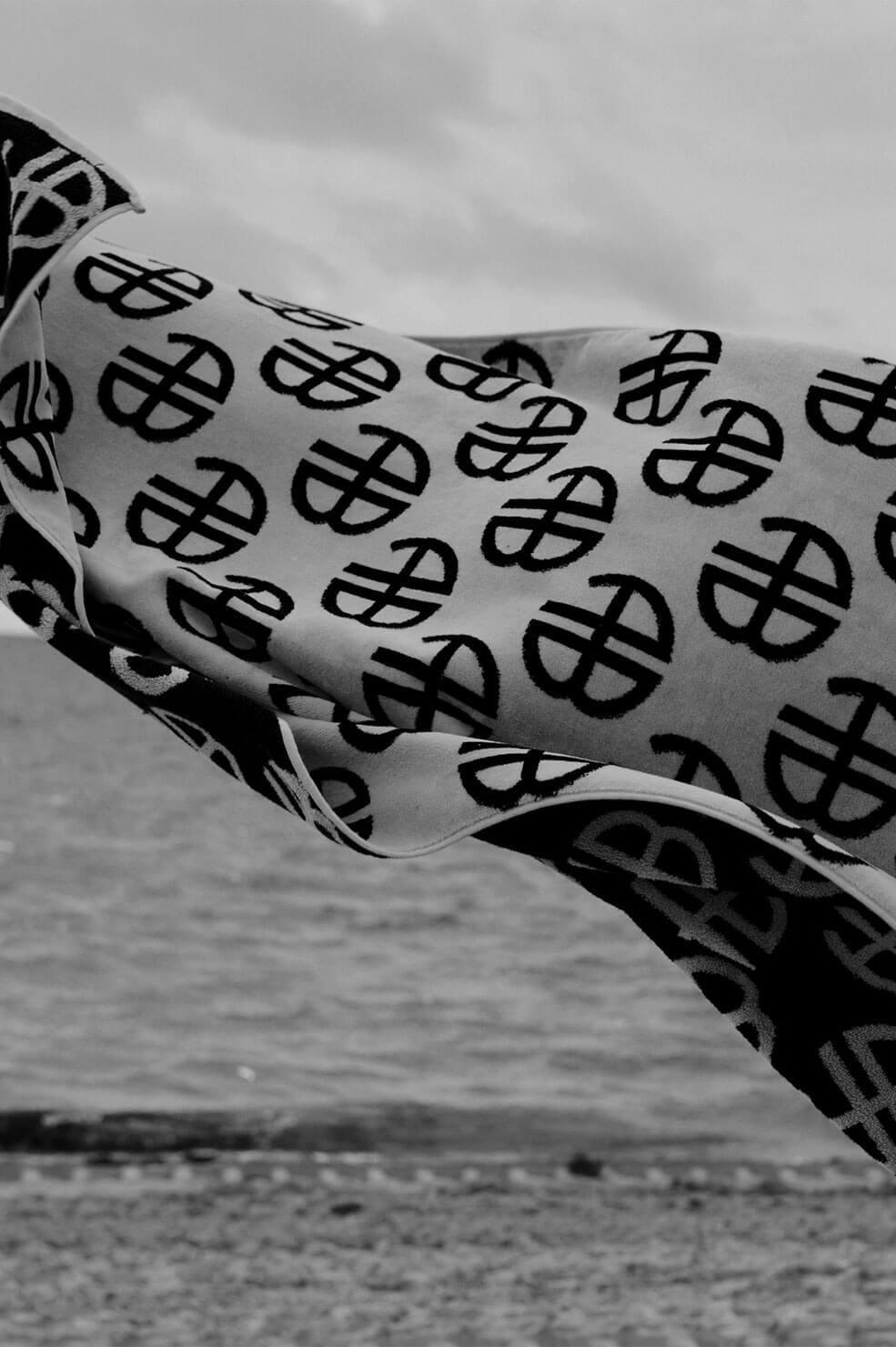 ANINE BING Bahia Towel - Beige Monogram Print - Campaign Image